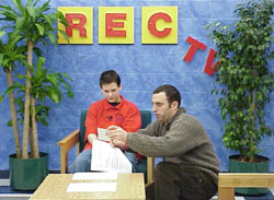 Student announcer, Jeff Mason being coached by Staff Advisor, Peter Oldreive.