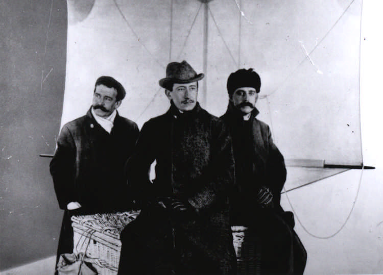 Kemp, Marconi, and Paget pose in front of a kite, Dec. 1901