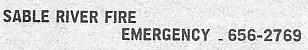 Telephone numbers for reporting fires in the Sable River vicinity, in 1991